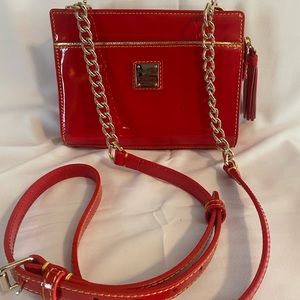 Dooney & Bourke red patent leather crossbody bag.